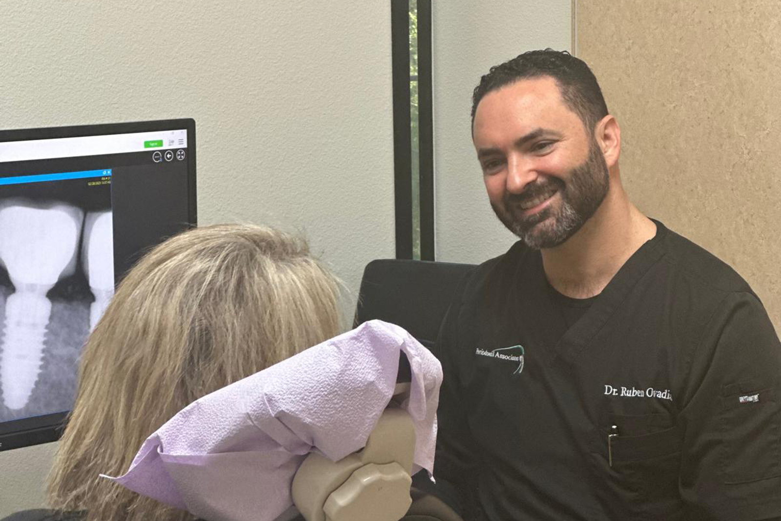 Dr. Ovadia talking to a patient