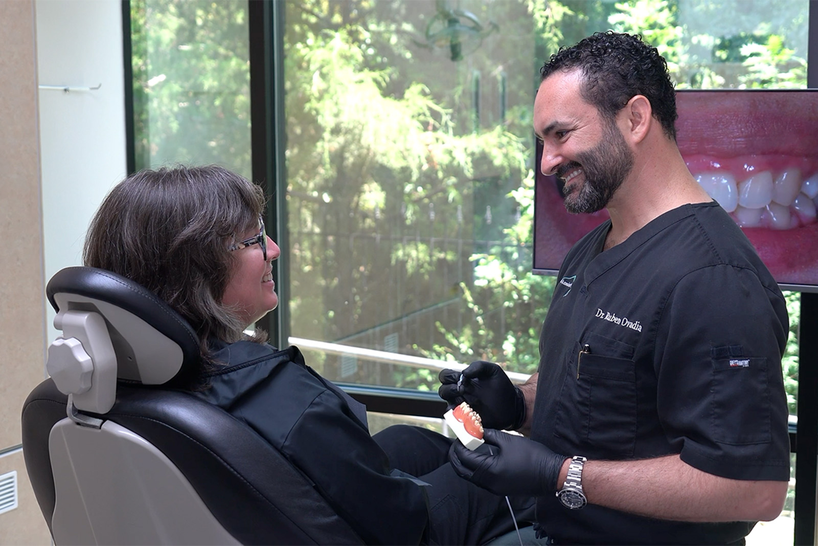 Dr. Ovadia talking to a patient during an exam