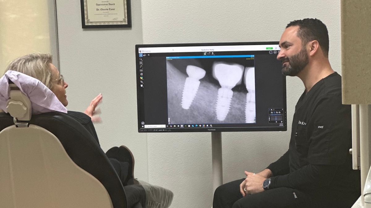 Dr. Ovadia discussing with an implant patient