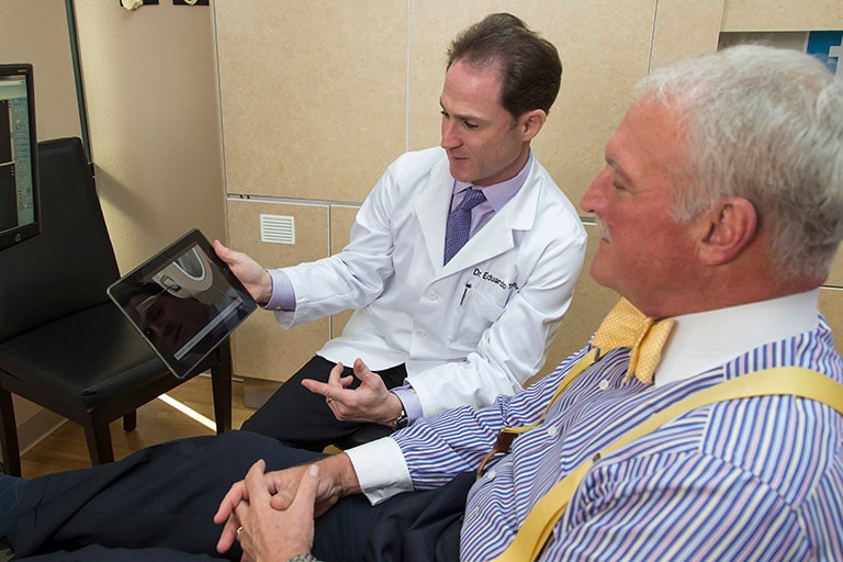Dentist showing digital presentation to patient